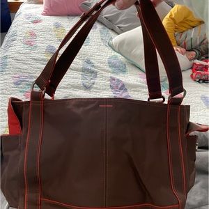 REACTION (by Kenneth Cole) large shoulder bag with orange lining.